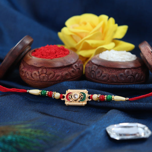 Rectangular Meenakari Rakhi With Golden Base And Red-green Beads