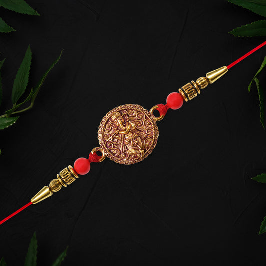 Antique Ganesha Coin Rakhi With Red Beads