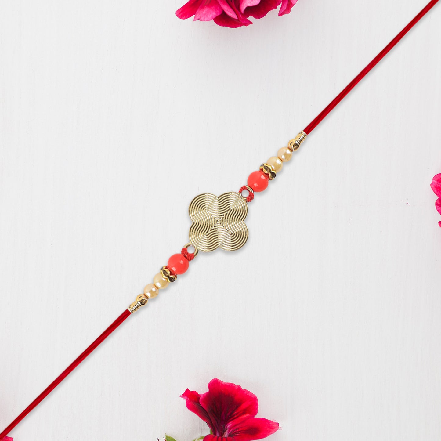 Rakhi With Multicolor Beads Silver Accents On Red Thread