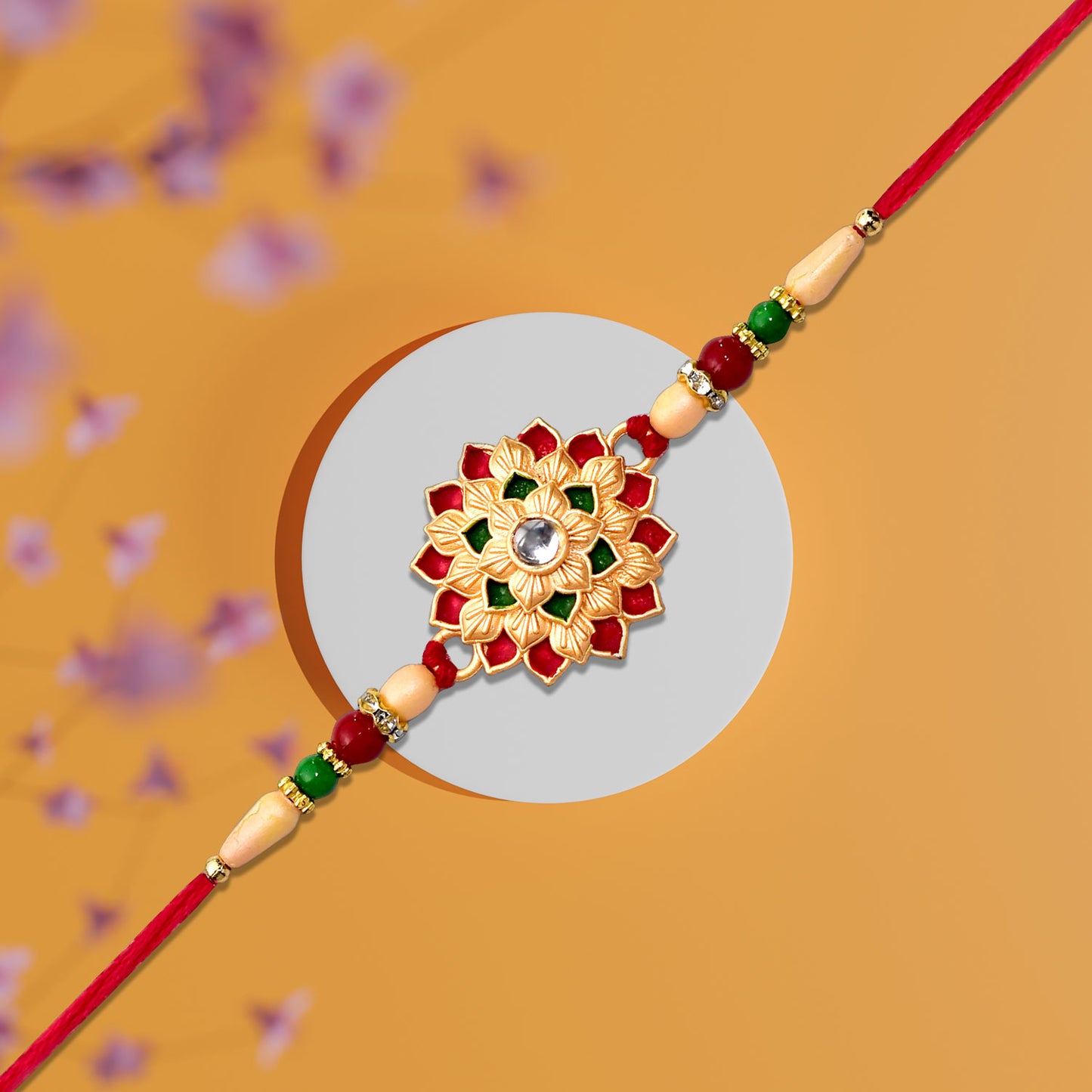 Designer Floral Rakhi With Beaded Strap  Red Green  Gold Accents