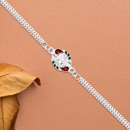 Designer Rakhi With Ornamental Floral Motif And Silver Finish Chain
